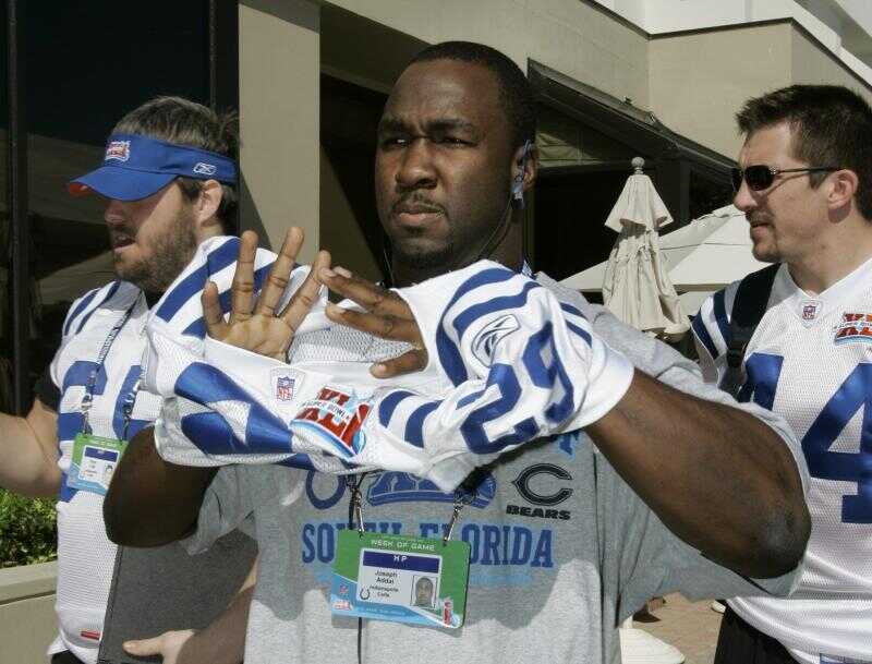 Running back Joseph Addai poses with his jersey after being