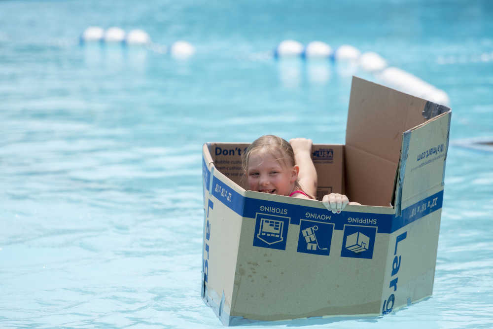 Boat made with a cardboard box  Cardboard boat, Kids role play, Cardboard  box boats